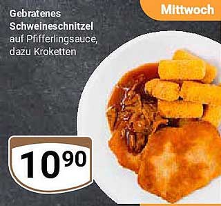 Gebratenes Schnitzel auf Pfeffersauce, dazu Kroketten